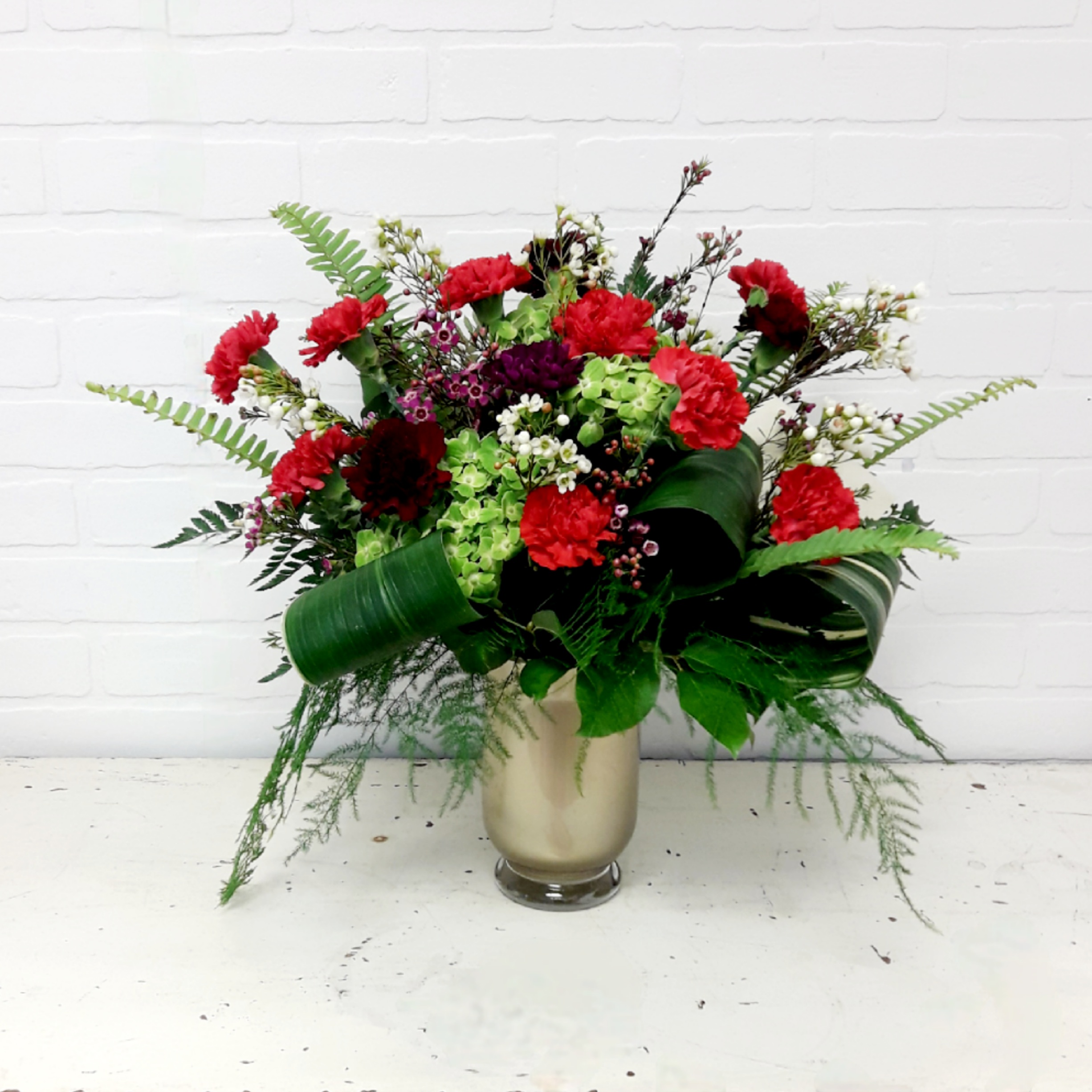 Carnation Celebration 12 Red Carnations in a Vase
